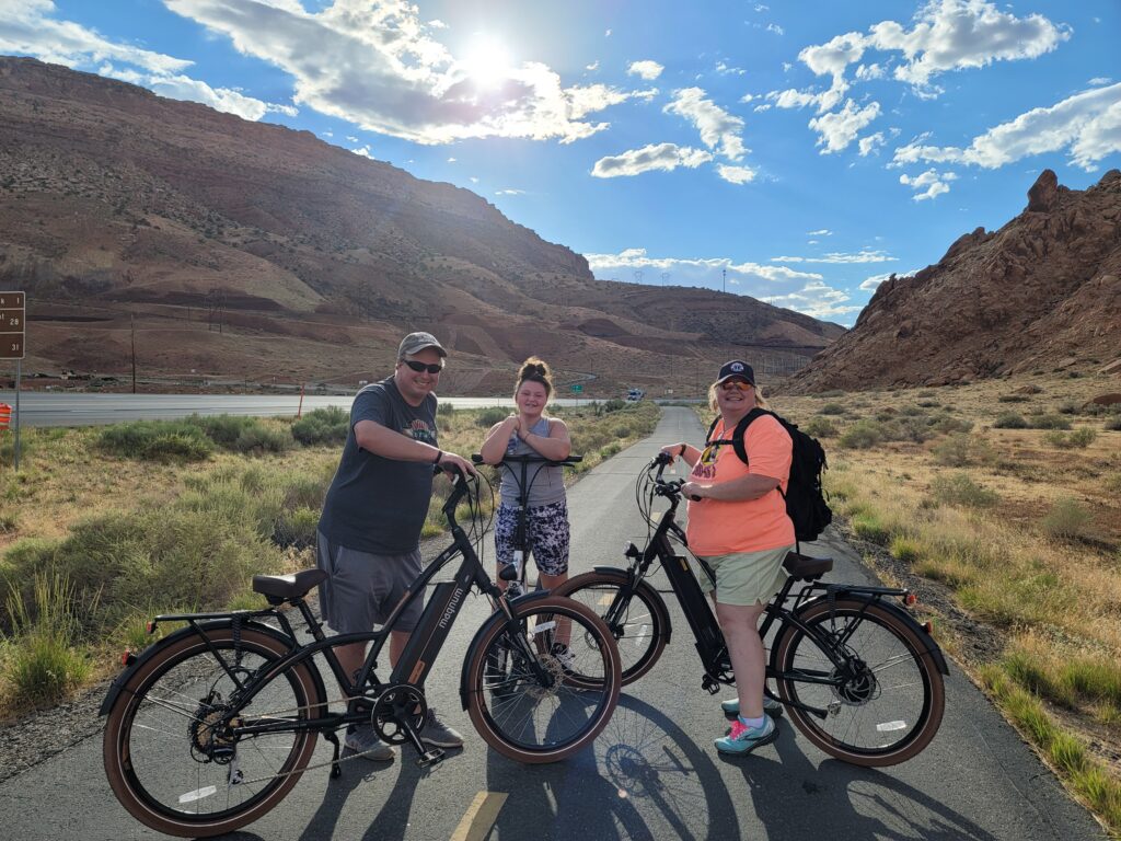 Family on e-bikes near Moab