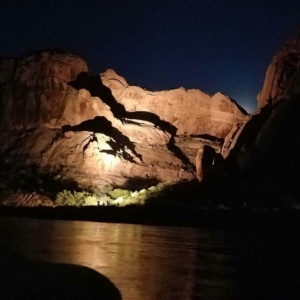 Guests pointing at highlighted rock formations during the choreographed lighting portion of the Sound and Light Show