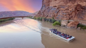 Guests seated with blankets aboard the jet boat for the evening Sound and Light Show tour