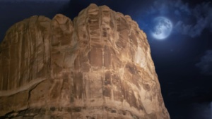 Iconic Moab red rock formations illuminated from the Colorado River during the Sound and Light Show