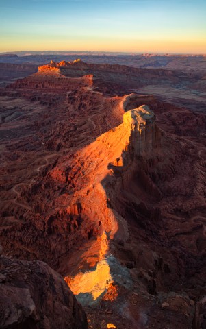Sunset on the rugged canyon desert topography from the Anticline overlook south of Moab Utah. Sunset over Canyonlands National Park from Hurrah Pass trail